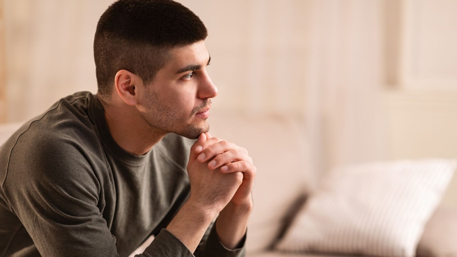 A person thoughtfully considering questions about Christian faith