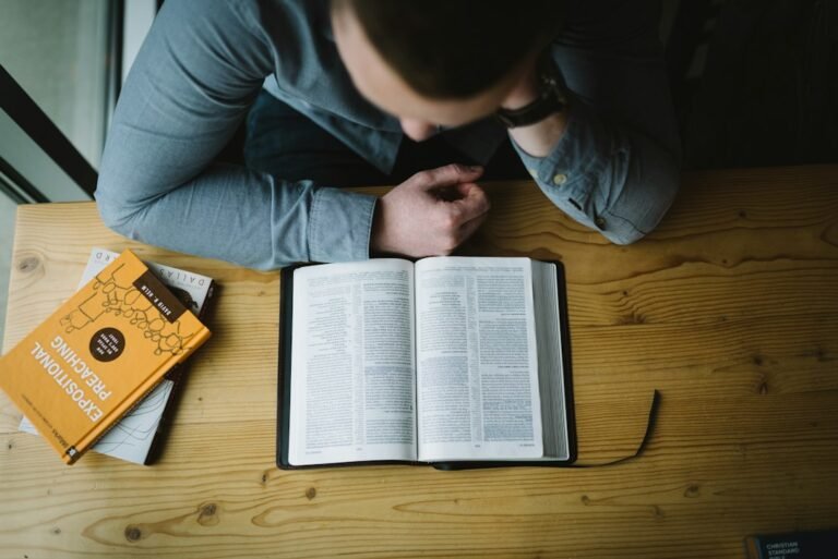 Man studying the Bible during a thoughtful conversation